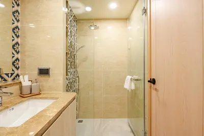 a bathroom with a glass shower and a sink at The Ozone Condominium 514 one bedroom in Laguna Phuket