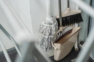 a broom and brushes are hanging in a room at Chic Condo by Bcare - Purple Rose in Karon Beach
