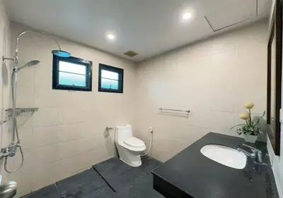 a bathroom with a toilet and a sink and a shower at 3 Bedroom Renovated Villa 3 minutes to the beach in Karon Beach