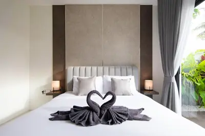 two heart shaped towels on a bed in a bedroom at Luxury Modern Villa Phuket - Thala in Phuket