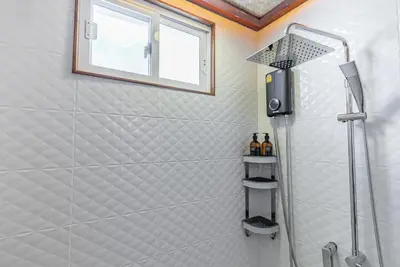 a shower in a bathroom with a window at Private Designer Villa with Pool Prime Rawai 3 beds in Ban Saiyuan (1)