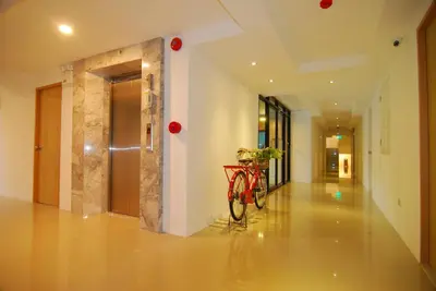 a bike parked in the hallway of a building at Leelawadee Naka in Phuket Town