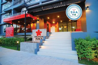 a restaurant with stairs leading up to a building at Leelawadee Naka in Phuket Town