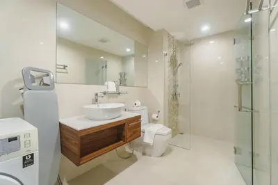 a bathroom with a sink and a toilet and a shower at D401 Title Rawai Beach Front 2 Bedroom Apartment in Rawai Beach