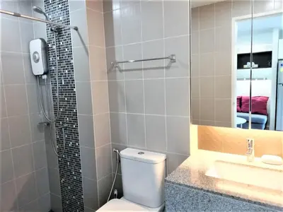 a bathroom with a toilet and a sink and a shower at A Fully Furnished Condo in the Phuket Center in Ban Ket Ho