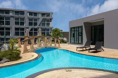 a swimming pool in front of a building at Duplex Loft near Nai Harn Beach with Pools & Gym - Utopia Loft B125 in Rawai Beach