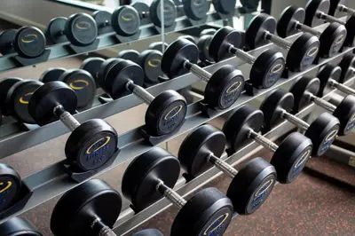 a rack of dumbbells in a gym at Duplex Loft near Nai Harn Beach with Pools & Gym - Utopia Loft B125 in Rawai Beach