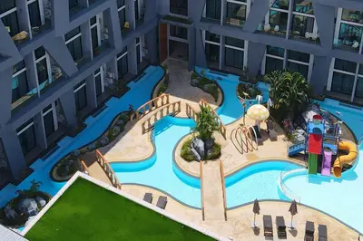 an overhead view of a swimming pool in a building at Duplex Loft near Nai Harn Beach with Pools & Gym - Utopia Loft B125 in Rawai Beach