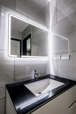 a bathroom with a sink and a mirror at The Legenda Bang Tao in Bang Tao Beach