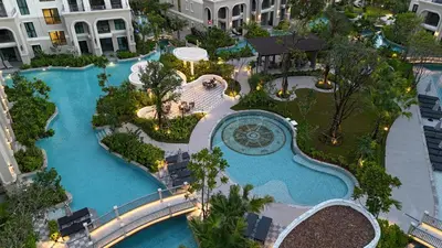 an aerial view of a pool at a resort at The Legenda Bang Tao in Bang Tao Beach