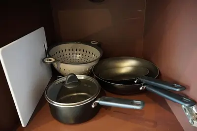 two pots and pans sitting on top of a counter at A Well Equipped Condo near Karon Beach in Karon Beach