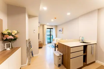a kitchen with a sink and a counter top at RJ Space in Ban Thalat Choeng Thale