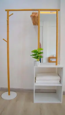 a white shelf with a potted plant and a mirror at Quiet & Comfy studio - Walk to Rawai Beach - 