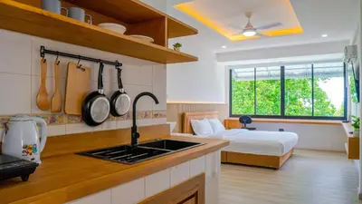 a kitchen with a sink and a bed in a room at Quiet & Comfy studio - Walk to Rawai Beach - 