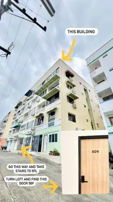 a building with a sign that says this building so go this way and take stairs at Quiet & Comfy studio - Walk to Rawai Beach - 