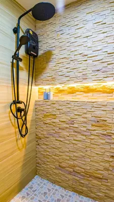a room with a brick wall with a camera at Quiet & Comfy studio - Walk to Rawai Beach - 