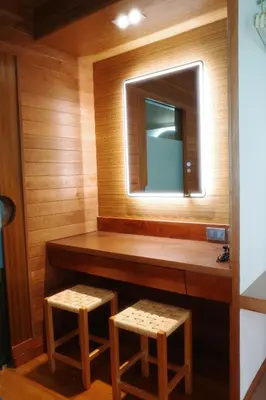 a sauna with two stools and a mirror at Salty Pearl Phuket 1 in Patong Beach