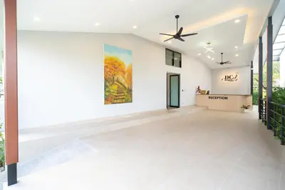 an empty lobby with a painting on the wall at DC Resident Phuket in Phuket Town