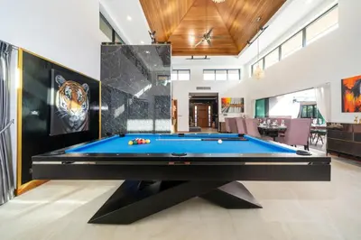 a billiard room with a blue pool table at Noi's Villa - tropical oasis with pool and maid in Kamala Beach