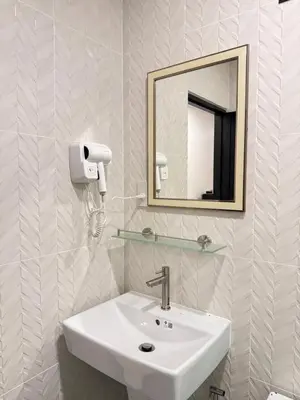 a bathroom with a sink and a mirror at Veeyava Bangtao House in Surin Beach