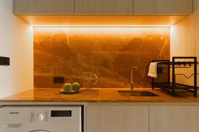 a kitchen with a counter top with a sink at The Ozone Terracotta Art Golf View Bangtao in Laguna Phuket