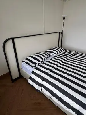 a black and white bed in a room at bége in Ban Lo Long
