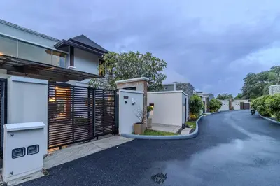 a street view of a house with a driveway at V241 3BR Peaceful Pool Villa, Garden & Jacuzzi in Koh Lone