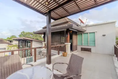 an outdoor patio with chairs and a pergola at V241 3BR Peaceful Pool Villa, Garden & Jacuzzi in Koh Lone