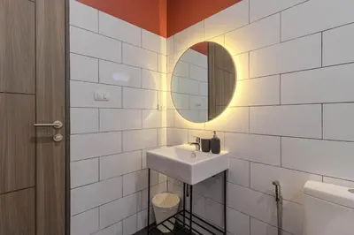a bathroom with a sink and a mirror at V242 Prime Location 2BR with Pool&Garden Near Beach in Bang Tao Beach