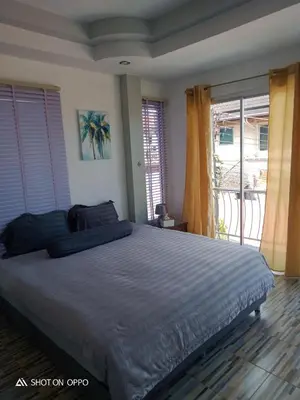 a bedroom with a large bed and a balcony at Villa Rawai Pool 3 Room in Ban Saiyuan (1)