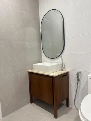 a bathroom with a sink and a mirror at House No 21-77 Near bangtao beach Phuket in Koh Lone