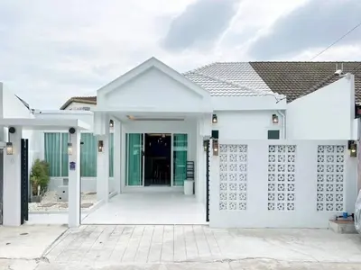 a white house with a white facade at Modern House in Phuket Town in Ban Na Khua