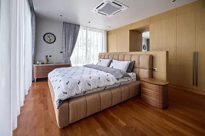 a bedroom with a large bed and a large window at Villa Botanica Modern Loft 2 in Ban Tha Rua