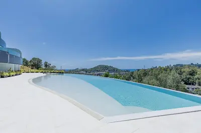 a swimming pool on the roof of a building at Beautiful Andamaya sea view in Ban Thalat Choeng Thale