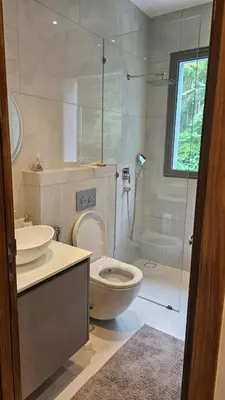 a bathroom with a toilet and a glass shower at Beautiful Andamaya sea view in Ban Thalat Choeng Thale
