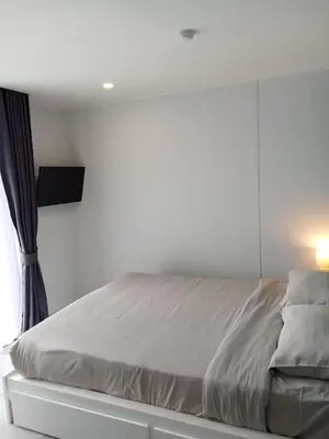 a white bedroom with a bed with a window at Stylish Urban Escape 1Bed Apt T2-822 in Chalong