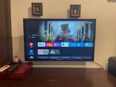 a flat screen tv sitting on top of a table at The Buddha Rawai Villa in Ban Saiyuan (1)