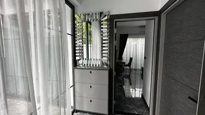 a room with a dresser and a large mirror at Exclusive 2BR Pool Villa in Ban Saiyuan (1)