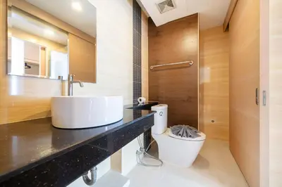 a bathroom with a sink and a toilet at Hillside 2BR Apartment with Pool & Gym 5 Min to Kamala Beach 48RK in Kamala Beach