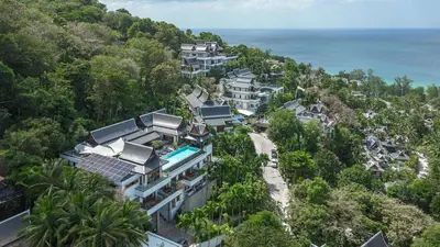 an aerial view of a resort on a hill next to the ocean at Luxurious Villa in Thalang with Private Pool and Ocean Views in Amphoe Thalang