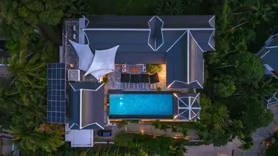 an overhead view of a house with a swimming pool at Luxurious Villa in Thalang with Private Pool and Ocean Views in Amphoe Thalang