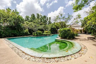a swimming pool in the middle of a yard at Tree Resort Palai v2 in Chalong