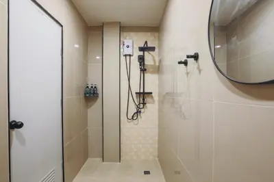 a bathroom with a shower and a mirror at Wink Hill 1 Penthouse Patong 4 Bedrooms in Patong Beach
