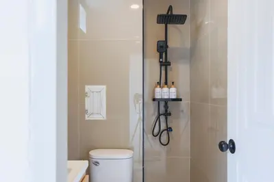 a bathroom with a shower stall and a toilet at Wink Hill 1 Penthouse Patong 4 Bedrooms in Patong Beach