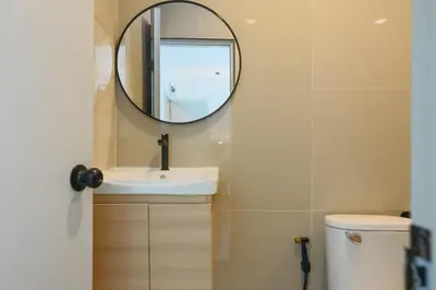 a bathroom with a sink and a mirror at Wink Hill 1 Penthouse Patong 4 Bedrooms in Patong Beach