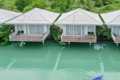 an aerial view of a house in the water at The wide view resort and restaurant Phuket in Thalang