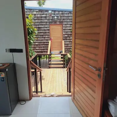 a door leading to a porch with a deck at The wide view resort and restaurant Phuket in Thalang