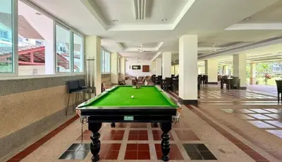 a pool table in the middle of a room at Palace - Spacious 1 bedroom Condo with shared Pool in Patong Beach