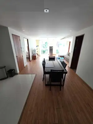 a living room with a table and chairs and a couch at Penthouse 3 bedrooms with sea view and pool - Privilege residence in Patong Beach