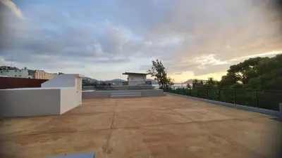 a view of a balcony with a sunset in the background at Penthouse 3 bedrooms with sea view and pool - Privilege residence in Patong Beach